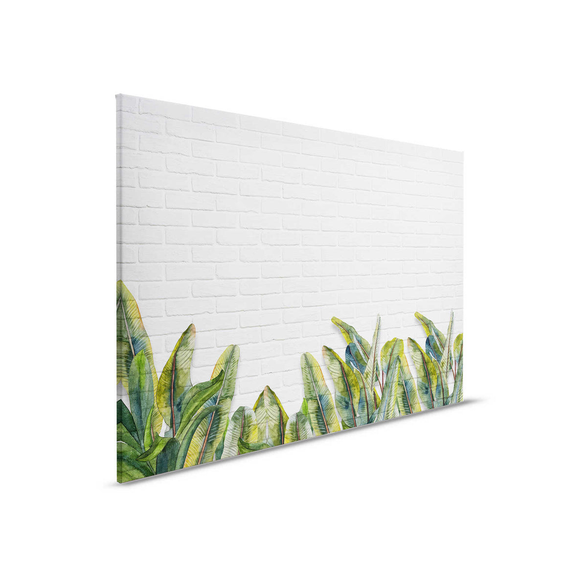 Cuadro en lienzo con hojas delante de pared de ladrillo blanco