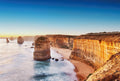 Fotomural Photo wallpaper landscape cliffs by the sea - blue, brown - DD Motive 2