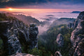 Fotomural Photo wallpaper sunrise in mountains - grey, green, white - DD Motive 2