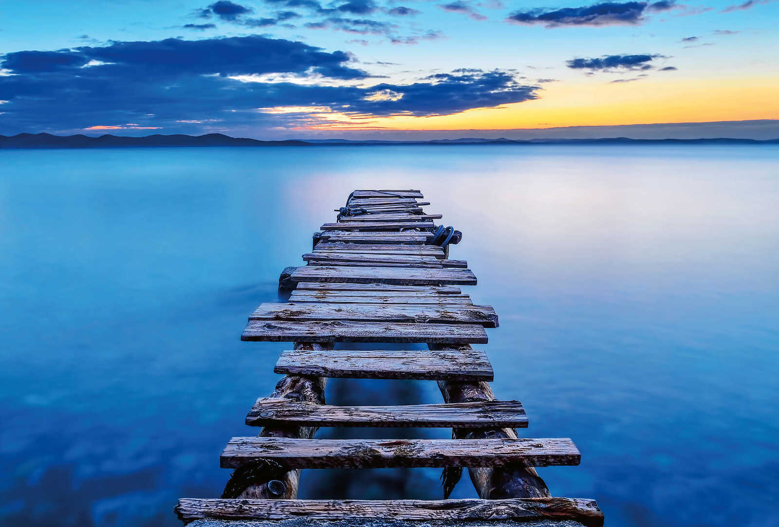 Fotomural Photo wallpaper old pier in the lake - blue, yellow, grey - DD Motive 2