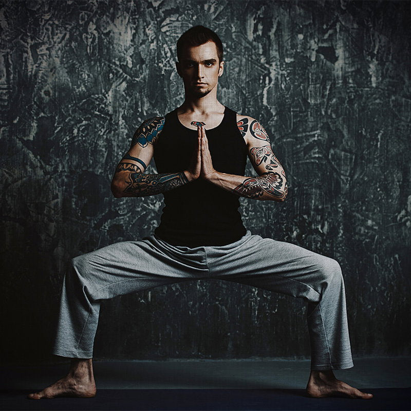 Fotomural Walls by Patel - Chandra 1 - Man doing yoga pose as photo wallpaper in natural linen structure - Blue, Black