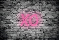 Fotomural Photo wallpaper stone wall with illuminated letters XO - DD Motive 2